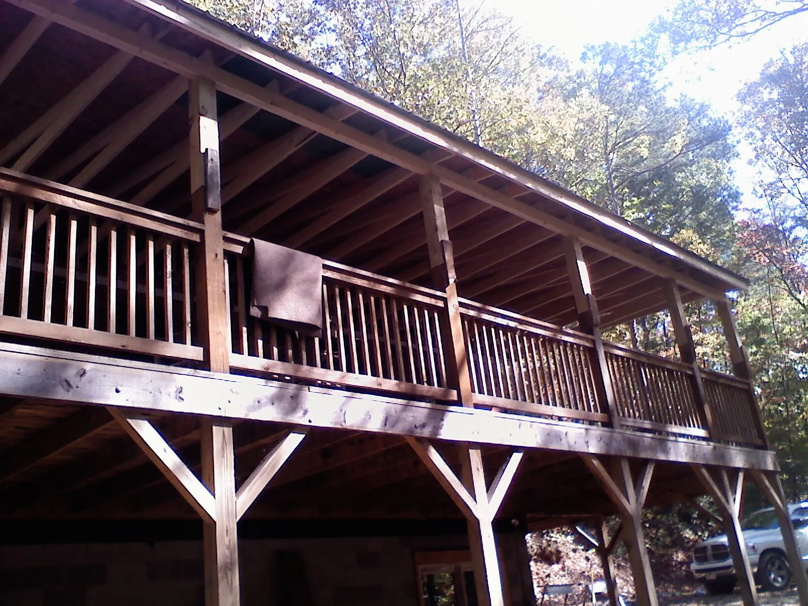 Timber framing under a new elevated porch and deck — Roof Leak Repair in Evans Mills by Roofing Brothers